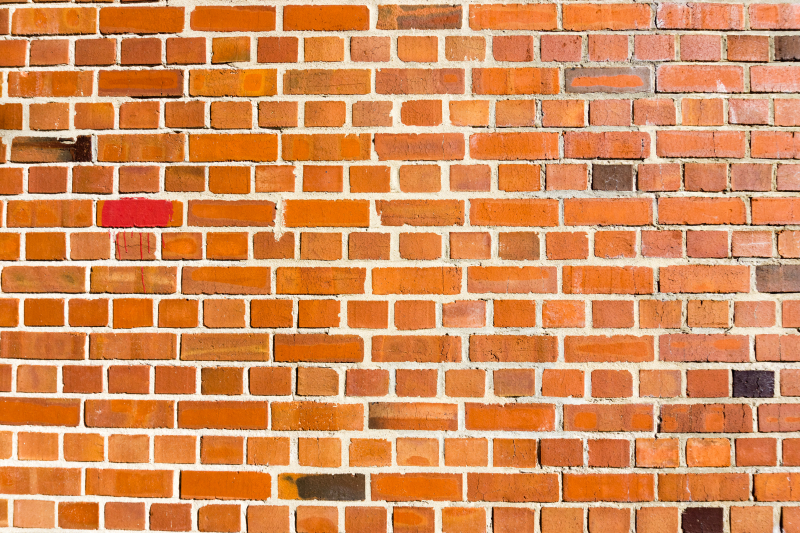 För- och nackdelar med olika fasader 32133139-red-brick-wall